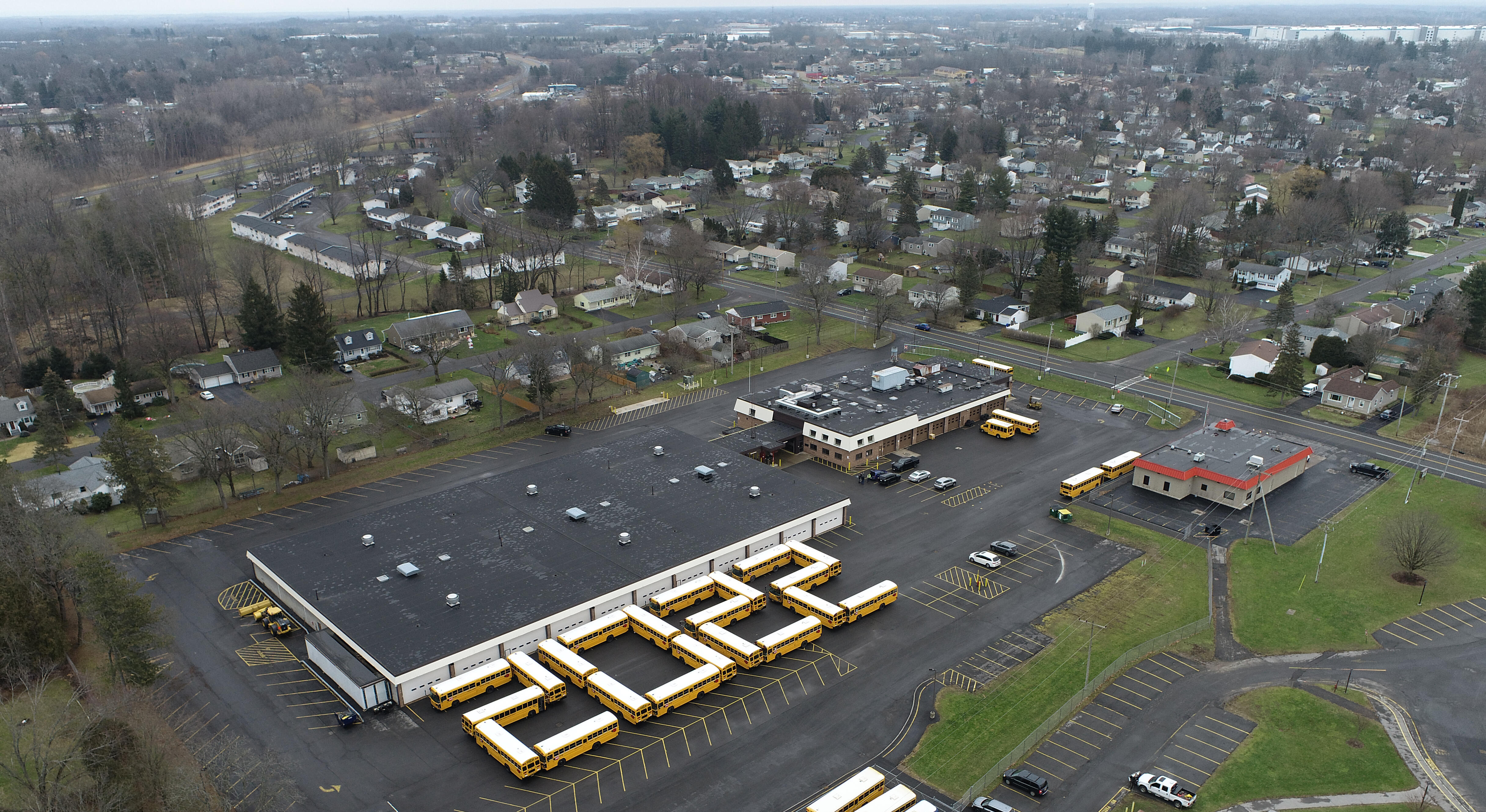 Aerial Photo of the LCSD Transportation Center with buses parked in the shape of 2022